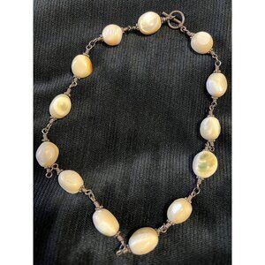 Shiva Eye Shell Necklace with sterling silver wire. Unique spherical beads.